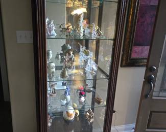 Lighted display case with sliding door.