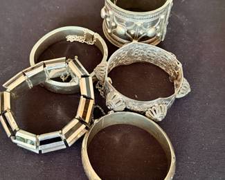 Silver cuffs and bangle bracelets