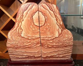 Large rock fossil on cherry wood stand