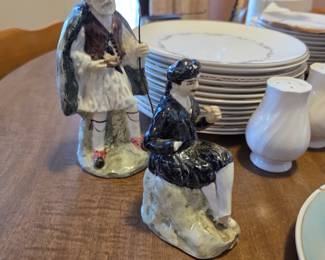 Capodimonte-style porcelain figurines, renowned for their intricate details and association with Italian porcelain craftsmanship. 