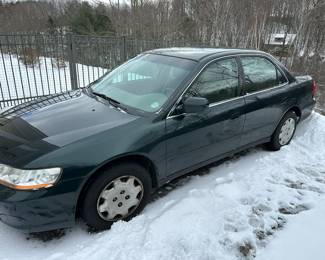 2000 Honda 4 door; body on damage on passenger side; runs well; rear seat damage