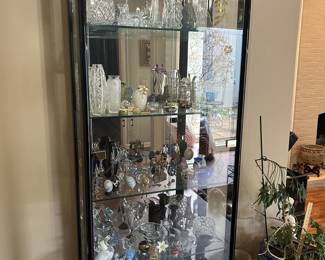 Lighted display cabinet full of treasures
