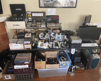 Lots of eclectic vinyl, cassettes, CDs, and DVDs. G3 Blue Mac with working Adobe software, monitors, media projector,  Xbox One with Kinect...