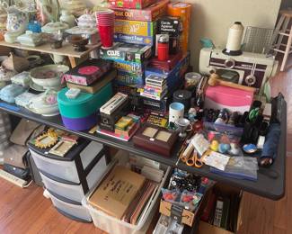 Rarely used popular family games, poker chip sets, sewing machine, and art goods.