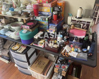 Rarely used popular family games, poker chip sets, sewing machine, and art goods.