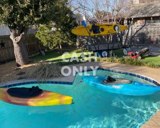 Whitewater Dagger CFS kayak with neoprene skirt, Otter kayak with spray skirt.