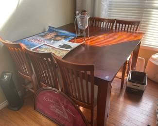 Counter-height dining table with built-in leaf.