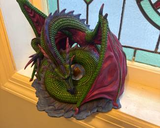 Earth Dragon with LED Egg Statue

A resin statue depicting a green dragon coiled around an egg that glows with an LED light.