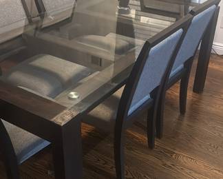 Table measures 42 inches wide and 76 inches long. The chairs are approximately 39 inches high.
Purchased  from Raymour and Flanagan over 4 years ago  

6 chairs have gray fabric on the backing and on the seating area 
