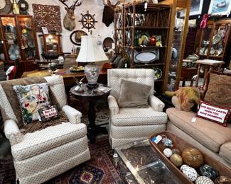 Pair of custom upholstered swivel club chairs