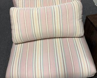 slipper chair with two pillows