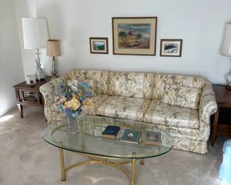 formal sofa, oval glass coffee table, side tables, lamps