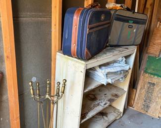 fire place tools, bookshelf, luggage