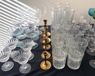 Assorted glassware, brass candlesticks