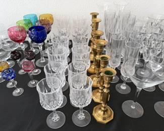 Assorted glassware, brass candlesticks