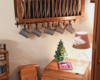 Hanging plate rack, pottery, bin, papoose cradle board.