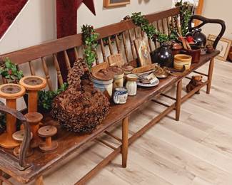 Long antique bench with iron arms, antiques.