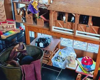 Toy stable, large antiques brass bucket, child's saddle and boots.