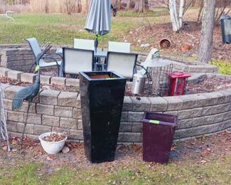 Patio set, planters, hose reel. Shed too full of yard equipment and tools.