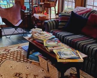Coffee table, sleeper, vintage style leather chair.