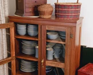 Drawers, pottery, glass front case.