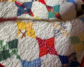 Handmade vintage quilt from grandma’s 1960’s dresses. 