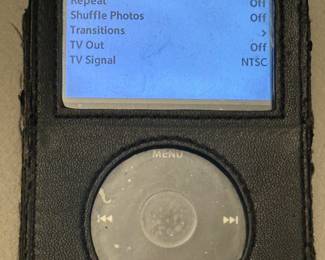 Apple iPod classic with black case and charging cord