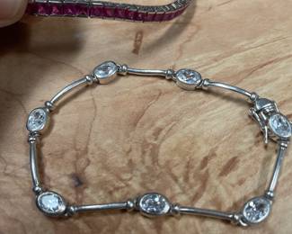 .925 bracelets w/ stones-    red /pink tennis bracelet style $35   cz bracelet $29