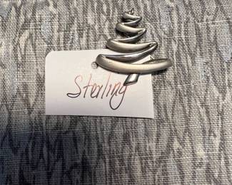 Lots of sterling silver rings, pendants, and necklaces.