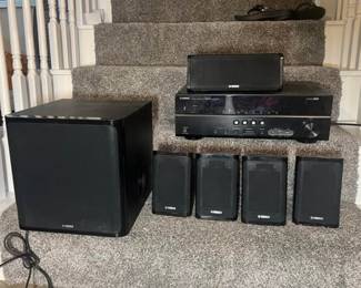 Yamaha seven piece set four speakers, which is part of a surround sound system 100 W of max input one center channel speaker one Yamaha subwoofer. This is a 5.1 channel home theater.!