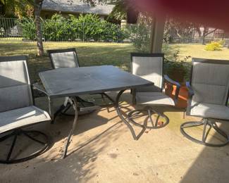 Patio table with four swivel chairs all in great condition