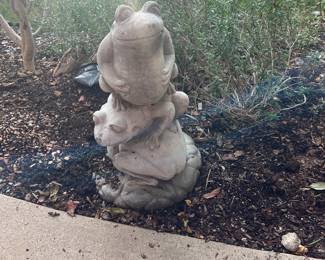 Super cute concrete frog statue.