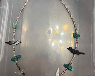 Hishi necklace with mother of pearl and black onyx birds and turquoise with a Sterling silver clasp. This is a Native American piece.