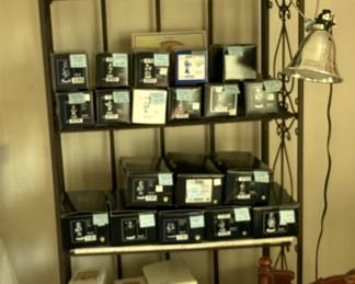 Many Hummel figurines in the box