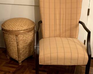 Soft yellow upholstered arm chair and woven basket