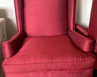 One of  a pair of red arm chairt