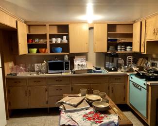 Lots of kitcken wares: pots & pans, knives, tools, serving ware, equipment, etc