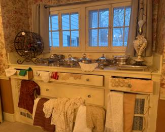 Wine rack and silver plate serving pieces