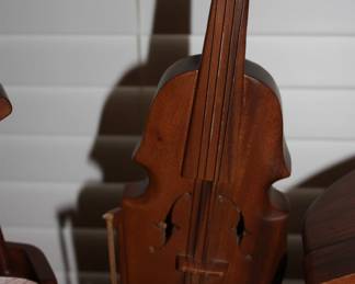 All hand carved instruments: Base fiddle on stand w/bow
