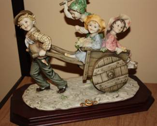 Cast: Young boy pulling cart w/girls riding