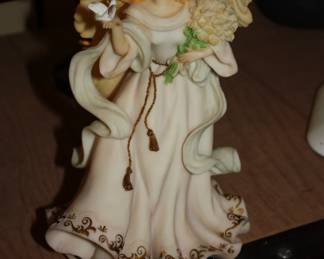 Cast angel: with bird & bouquet of flowers