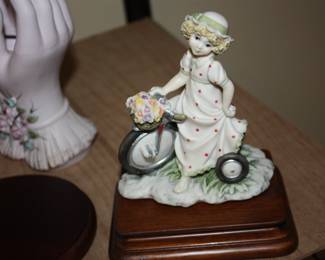 Porcelain girl on bicycle