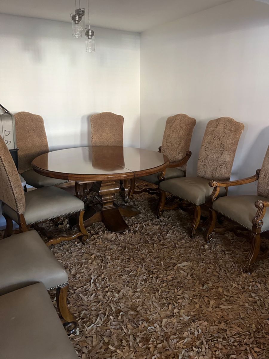 Gorgeous round or oval with leaf , dining room table and 8 parsons chairs. 
