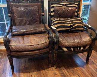 Pair of leather and cow skin arm chairs over sized and comfy