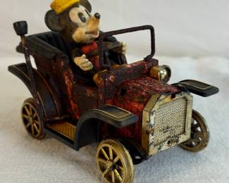 1908 Masudaya Corporation Mickey Mouse Machine toy car.
It is a vintage or antique collectible item.
The toy features Mickey Mouse in a vintage-style automobile.
It has a distinct 'rusty' or aged finish as a design choice.
The figure of Mickey Mouse appears to be non-removable.
1908 Masudaya Corporation Mickey Mouse Machine
Condition · As we define the condition of a MODEL · Sculpted Mickey figure (non removable) Vintage style roadster vehicle design. Glos...