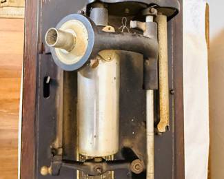 Antique Edison cylinder phonograph The phonograph features a large external horn, a hand crank, and a wooden base, likely made of oak. With records