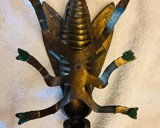 brass fly ashtray. The wings are typically hinged and pivot open to reveal a compartment for cigarettes or trinkets. Italian