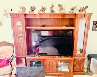 This is a solid oak wood entertainment wall unit.