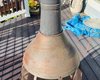 Chimineas typically have a bulbous body and a vertical smoke vent or chimney.