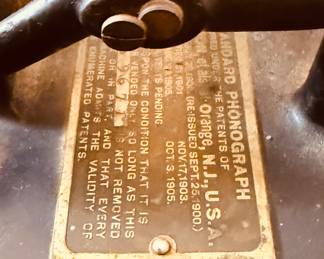 Antique Edison cylinder phonograph The phonograph features a large external horn, a hand crank, and a wooden base, likely made of oak. With records